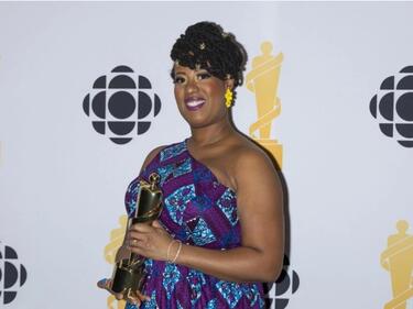 Raquel McIntosh poses for photos after winning the Teacher of the Year Award during the 2026 Juno Awards in Hamilton.