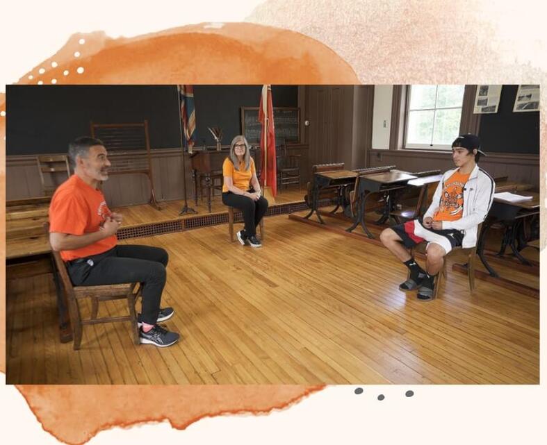 2 adults and young person in classroom